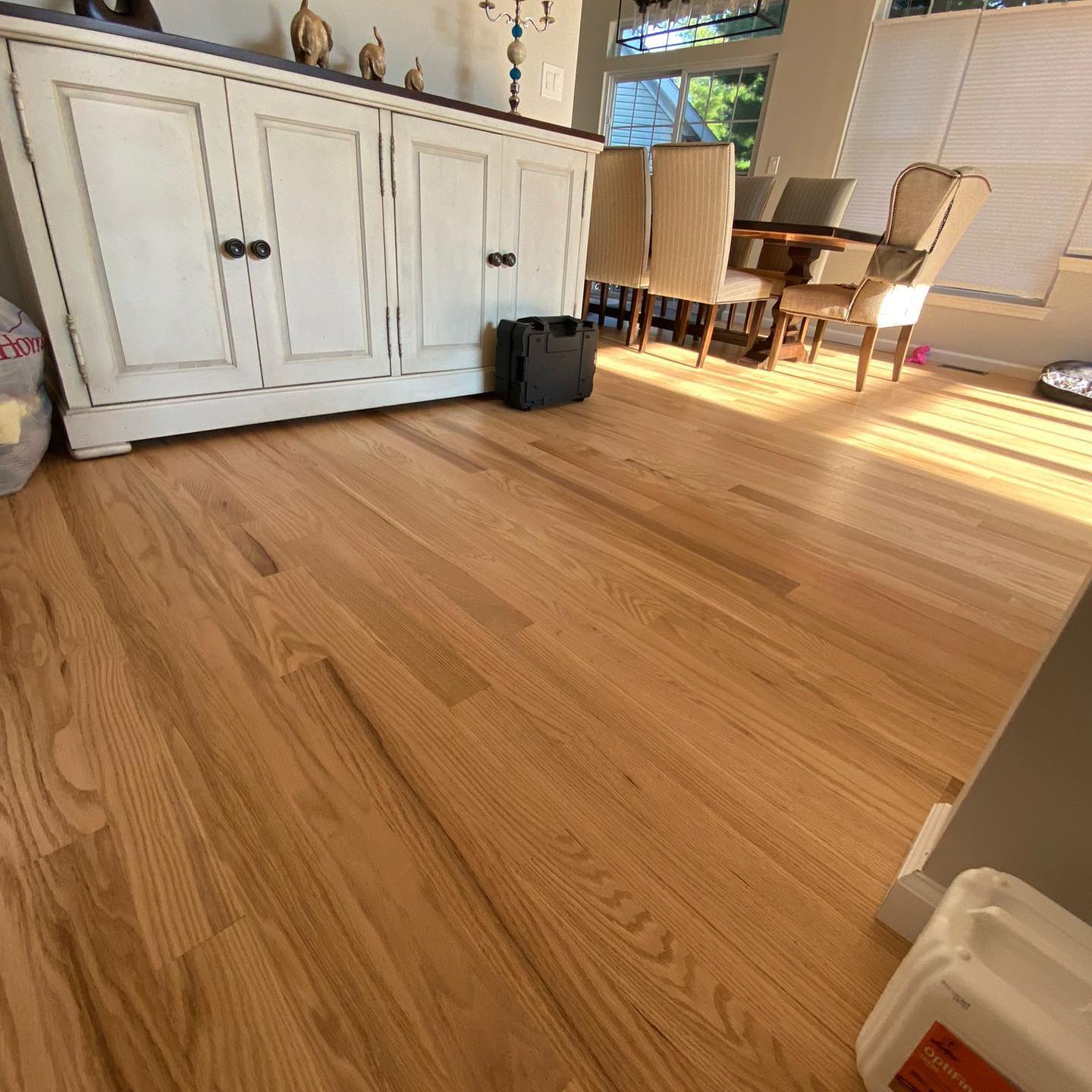 Hardwood floor refinishing in Manalapan, NJ — before and after Floor Supreme